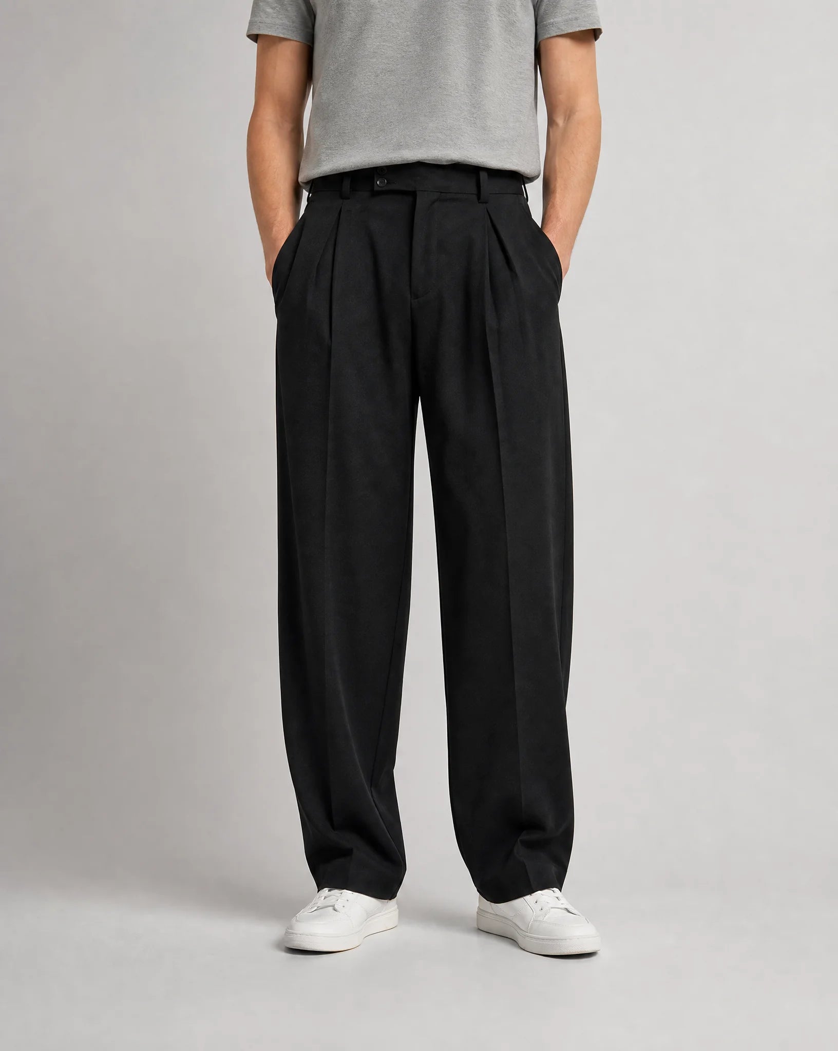 Men's black wide leg pleated tailored trousers with high waist, double front pleats and relaxed smart-casual fit by ILYNORA