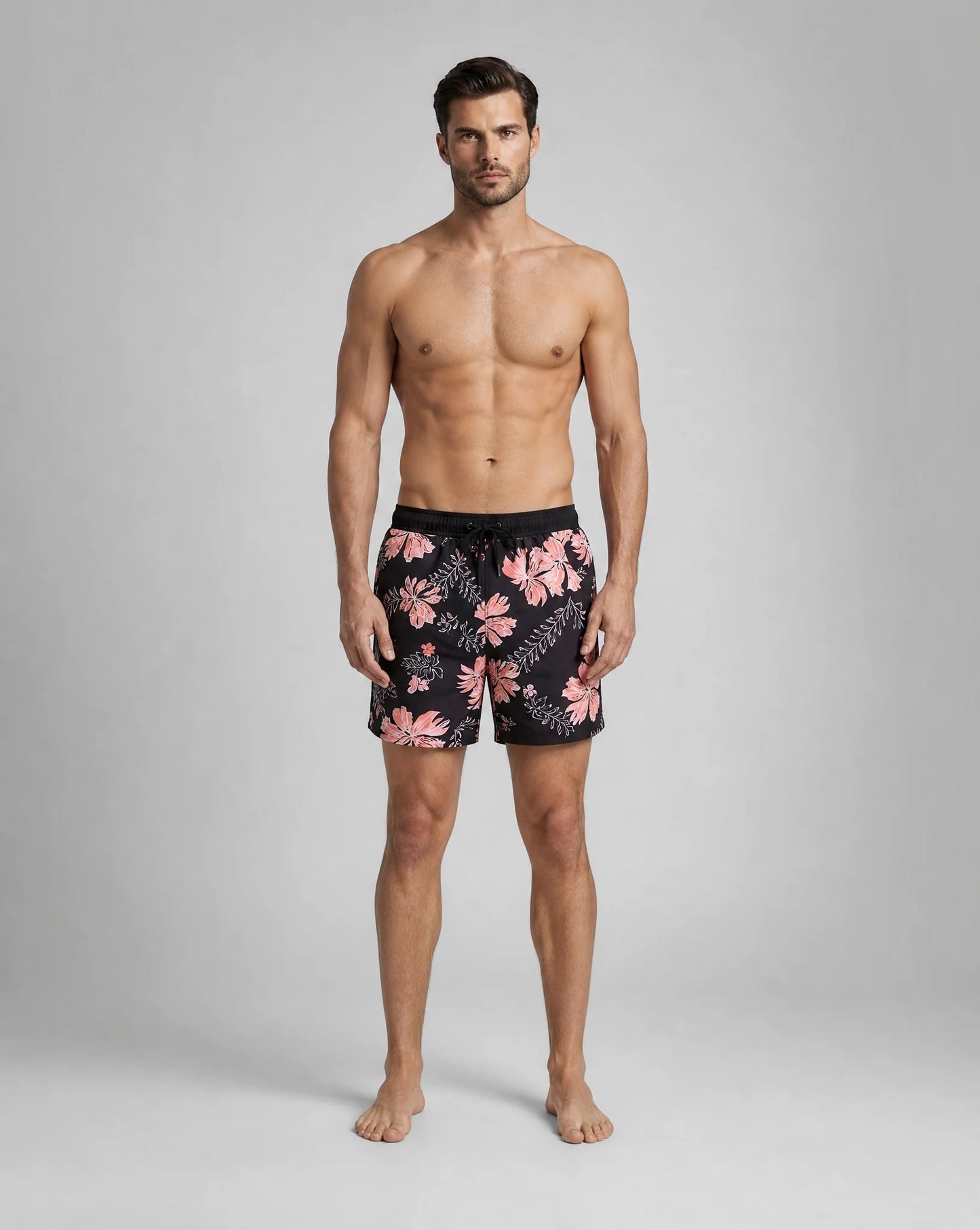Men's black orange compression lined swim shorts with vibrant beach pattern by ILYNORA