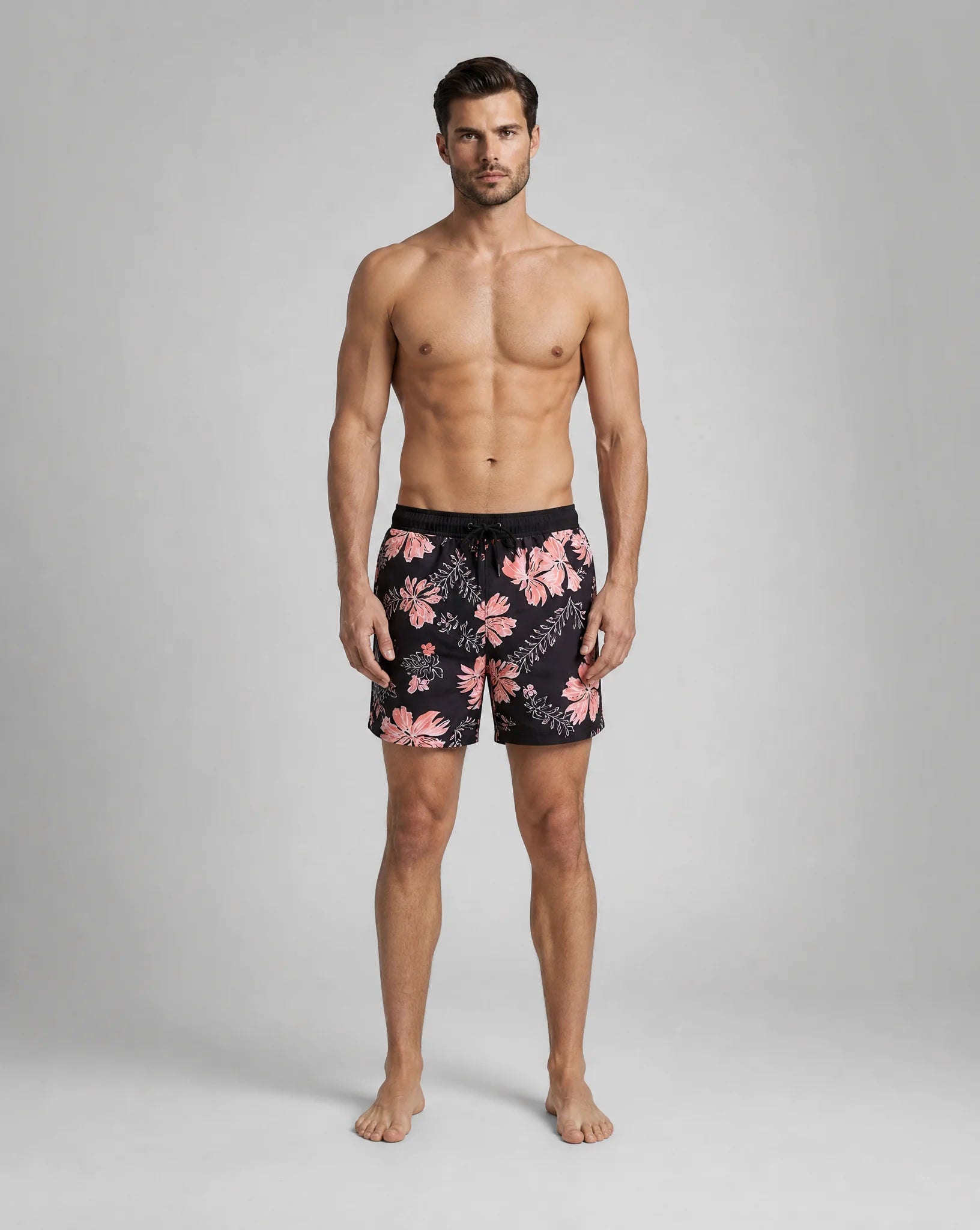 Men's black orange compression lined swim shorts with vibrant beach pattern by ILYNORA