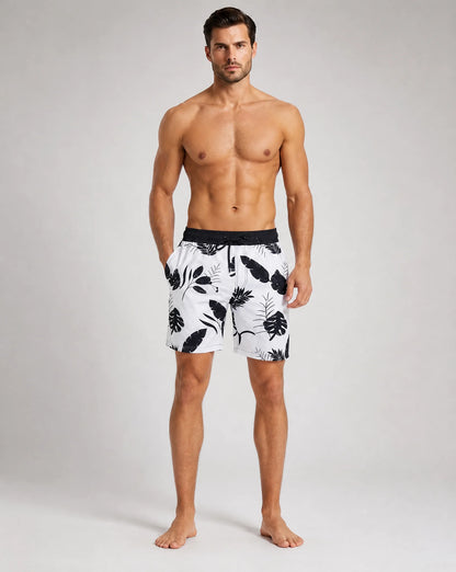 Men's monochrome flora swim shorts with compression liner and floral print by ILYNORA