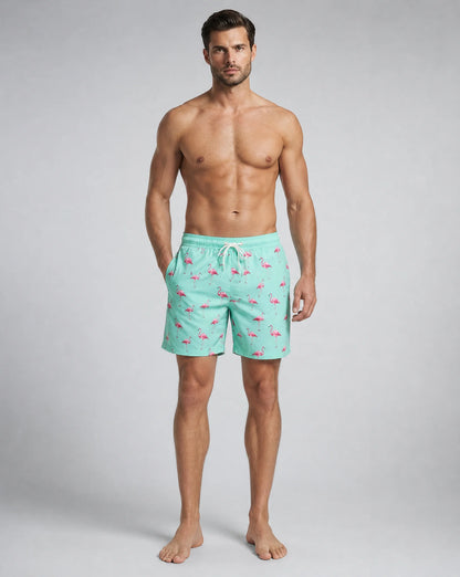 Men's pink flamingo compression lined swim shorts with colourful tropical design by ILYNORA