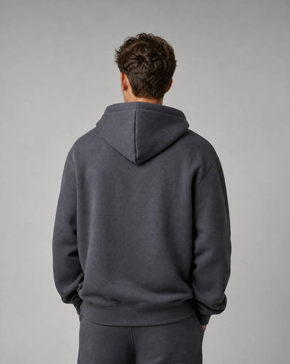 Men's dark grey relaxed fit hoodie with soft fleece lining, crossover hood and back view by ILYNORA