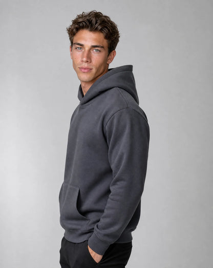 Men's dark grey relaxed fit hoodie with heavyweight brushed fleece fabric, ribbed cuffs and side profile by ILYNORA