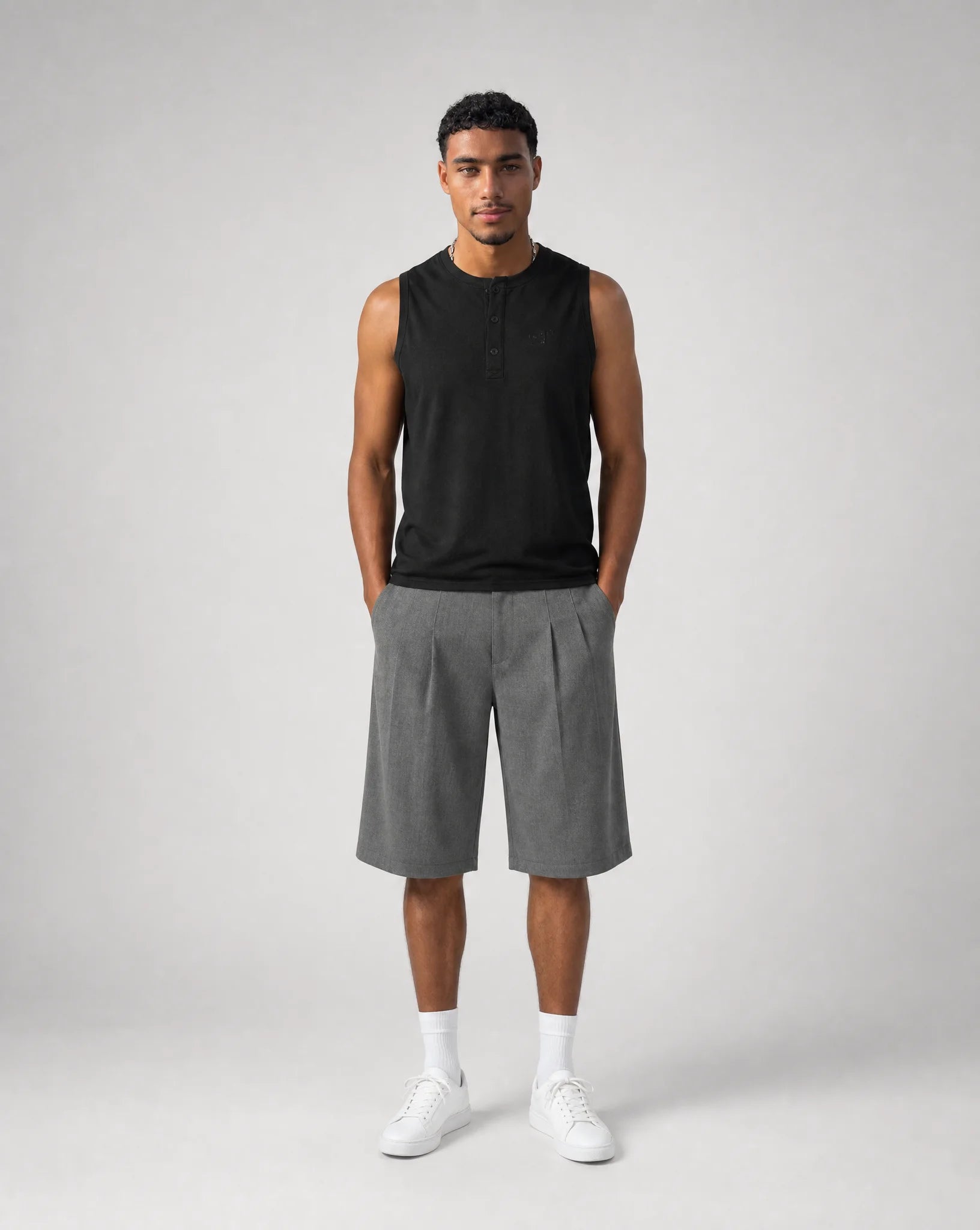 Full outfit featuring men's grey baggy bermuda shorts with front pleats, oversized fit and tailored summer styling by ILYNORA