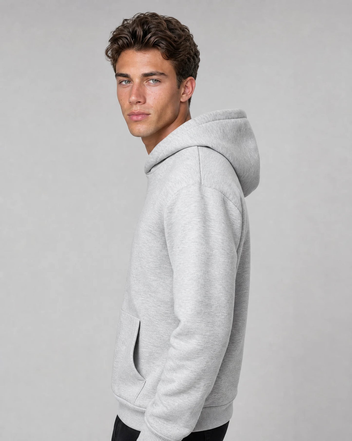 Men's light grey relaxed fit hoodie with soft fleece fabric, crossover hood and side profile by ILYNORA