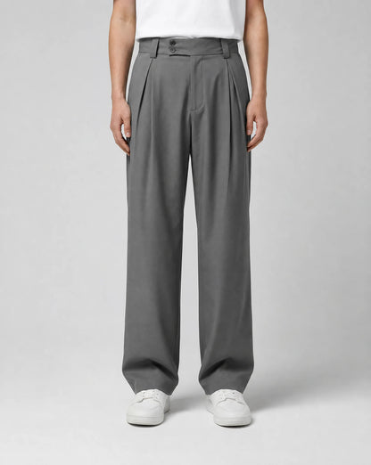 Men's grey wide leg pleated tailored trousers with high waist, double pleats and relaxed straight leg silhouette by ILYNORA