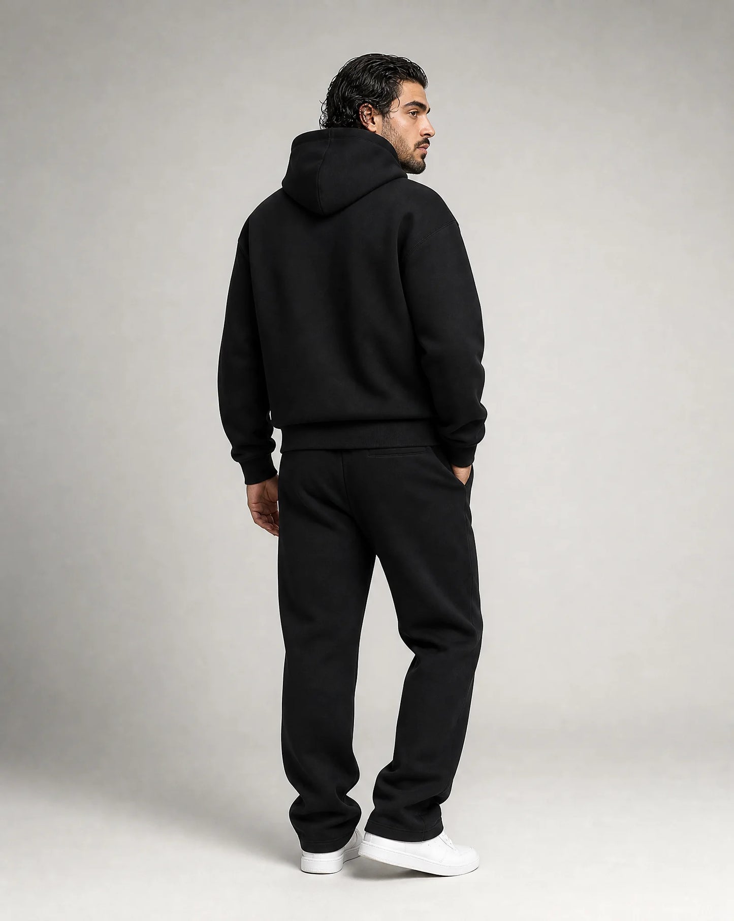 Black oversized hoodie and jogger set for men by Ilynora, back view showcasing the relaxed fit