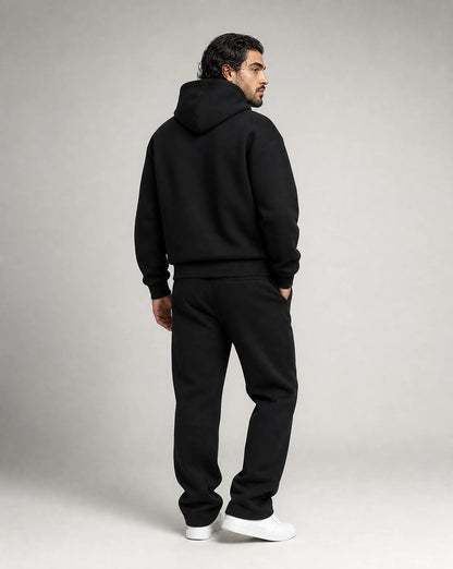 Black oversized hoodie and jogger set for men by Ilynora, back view showcasing the relaxed fit