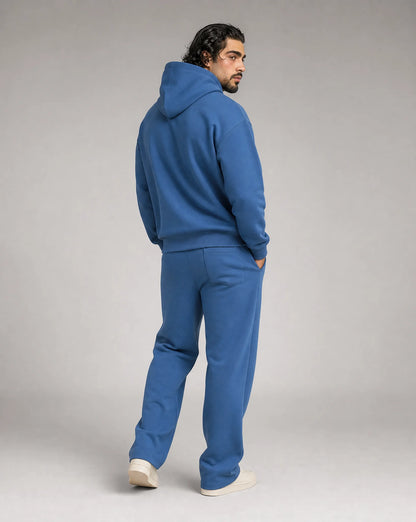 Blue oversized hoodie and jogger set for men by Ilynora, back view with comfortable oversized fit