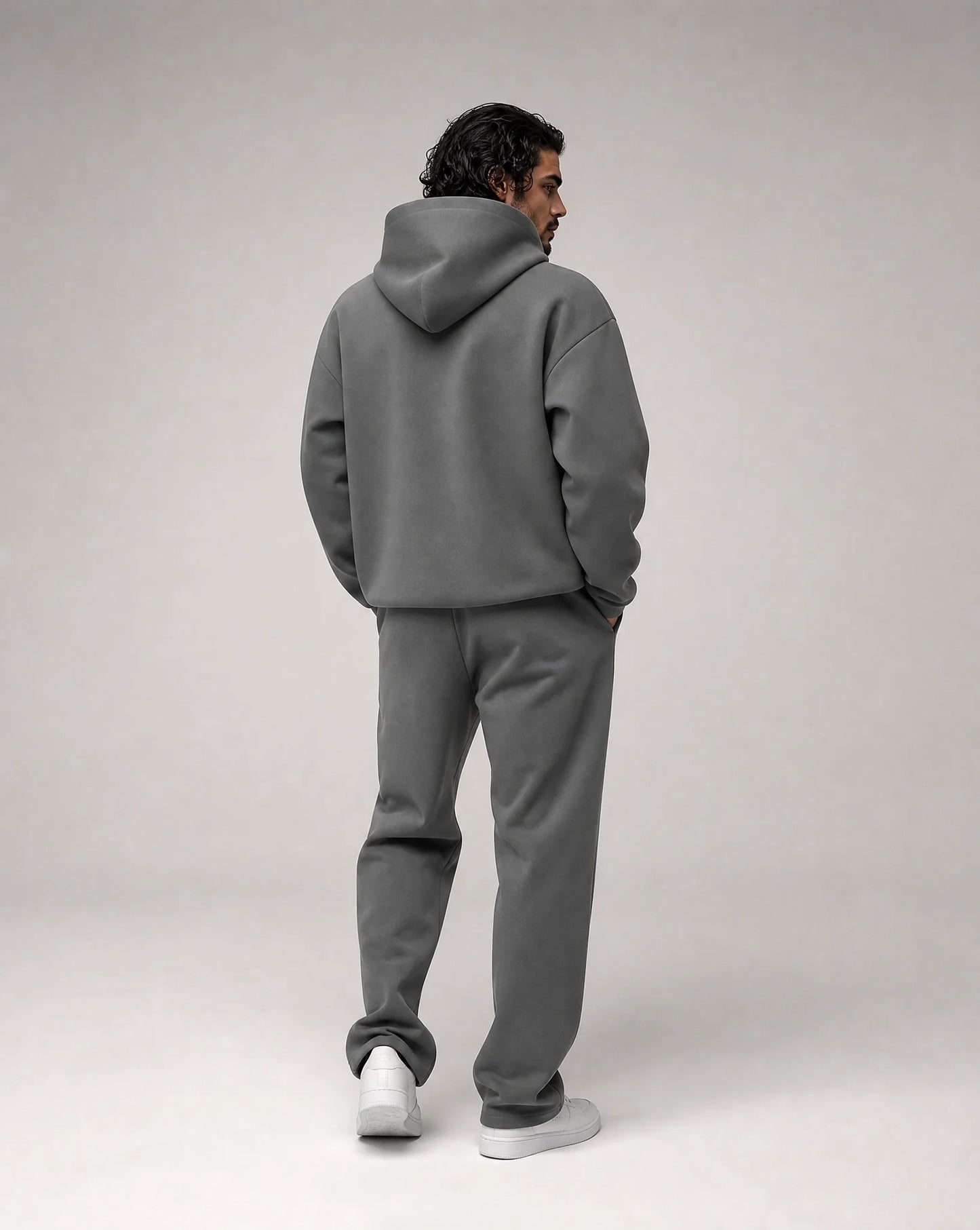 Dark grey oversized hoodie and jogger set for men by Ilynora, back view showcasing the oversized silhouette