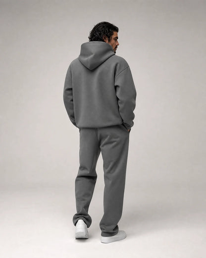 Dark grey oversized hoodie and jogger set for men by Ilynora, back view showcasing the oversized silhouette