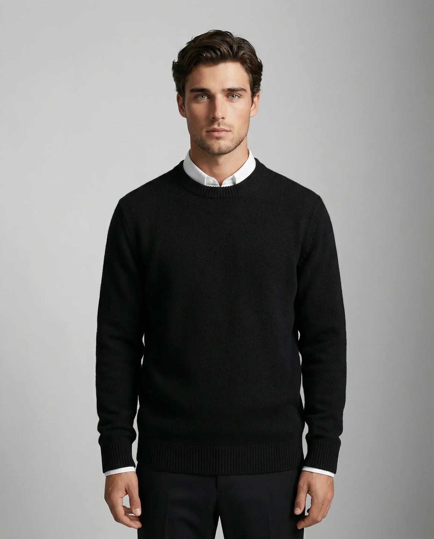 Men's cashmere crewneck sweater in black by Ilynora, front view with clean design and tailored fit
