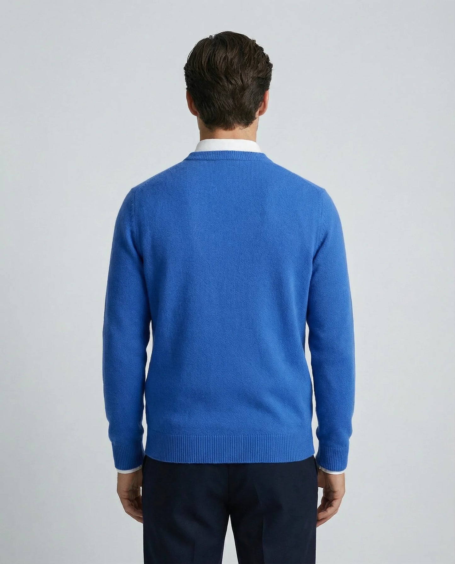 Blue cashmere sweater for men by Ilynora, back view highlighting clean silhouette and refined design