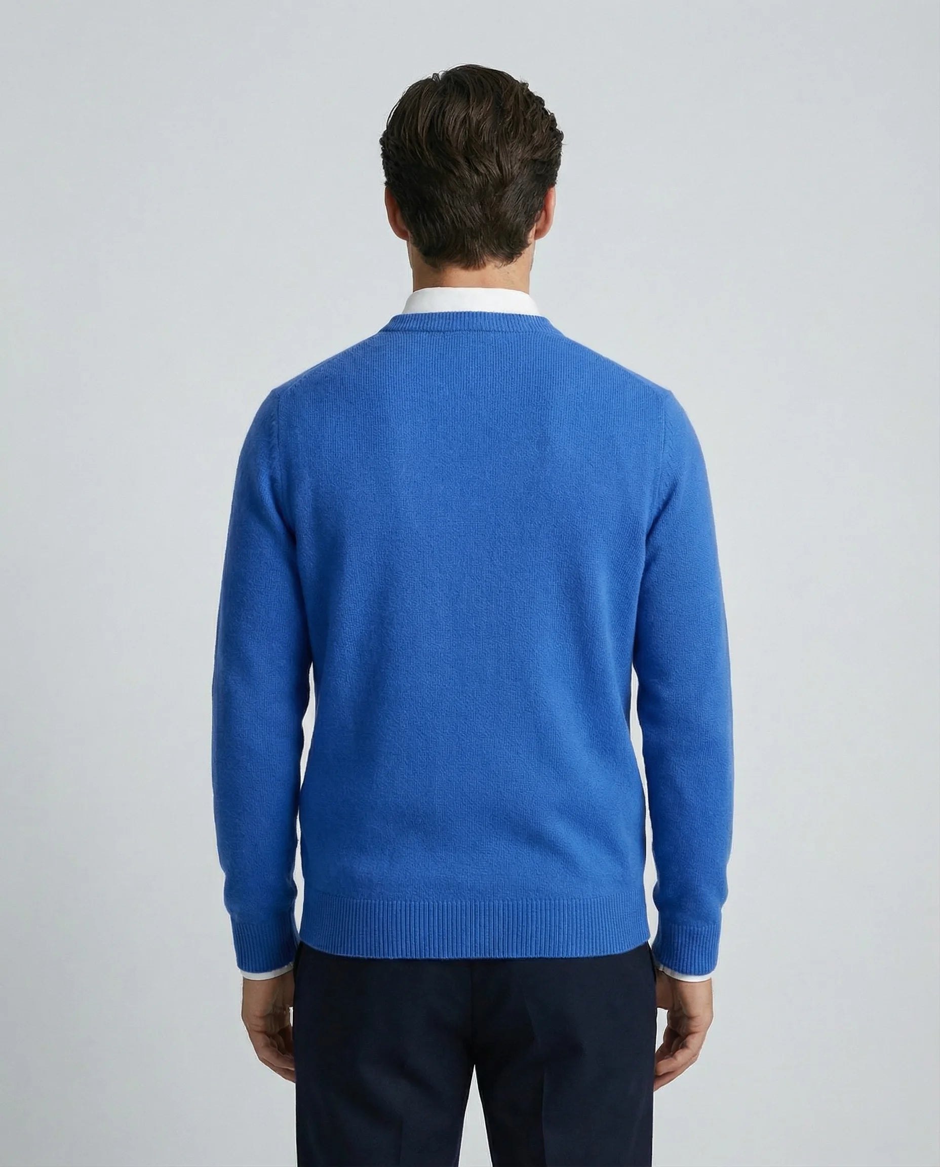 Blue cashmere sweater for men by Ilynora, back view highlighting clean silhouette and refined design