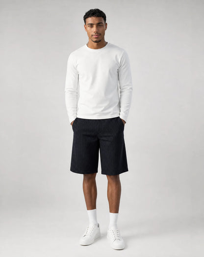 Full outfit featuring men's navy pinstriped bermuda shorts with baggy tailored fit and embroidered back pocket detail by ILYNORA