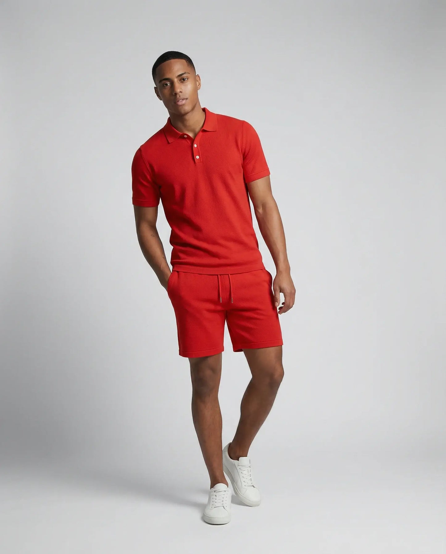 Orange polo and shorts summer set by Ilynora, full body view showing relaxed silhouette and lightweight fabric
