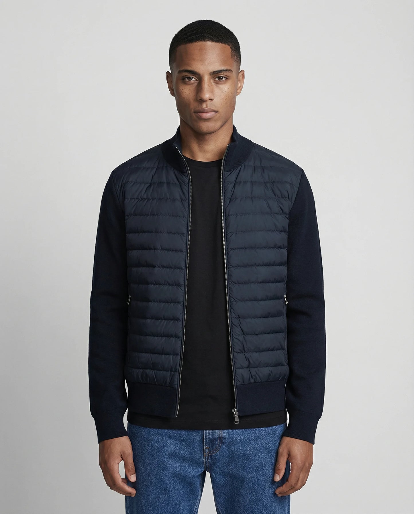 Men's quilted knit bomber jacket in navy blue by Ilynora, front view with padded panel and clean silhouette