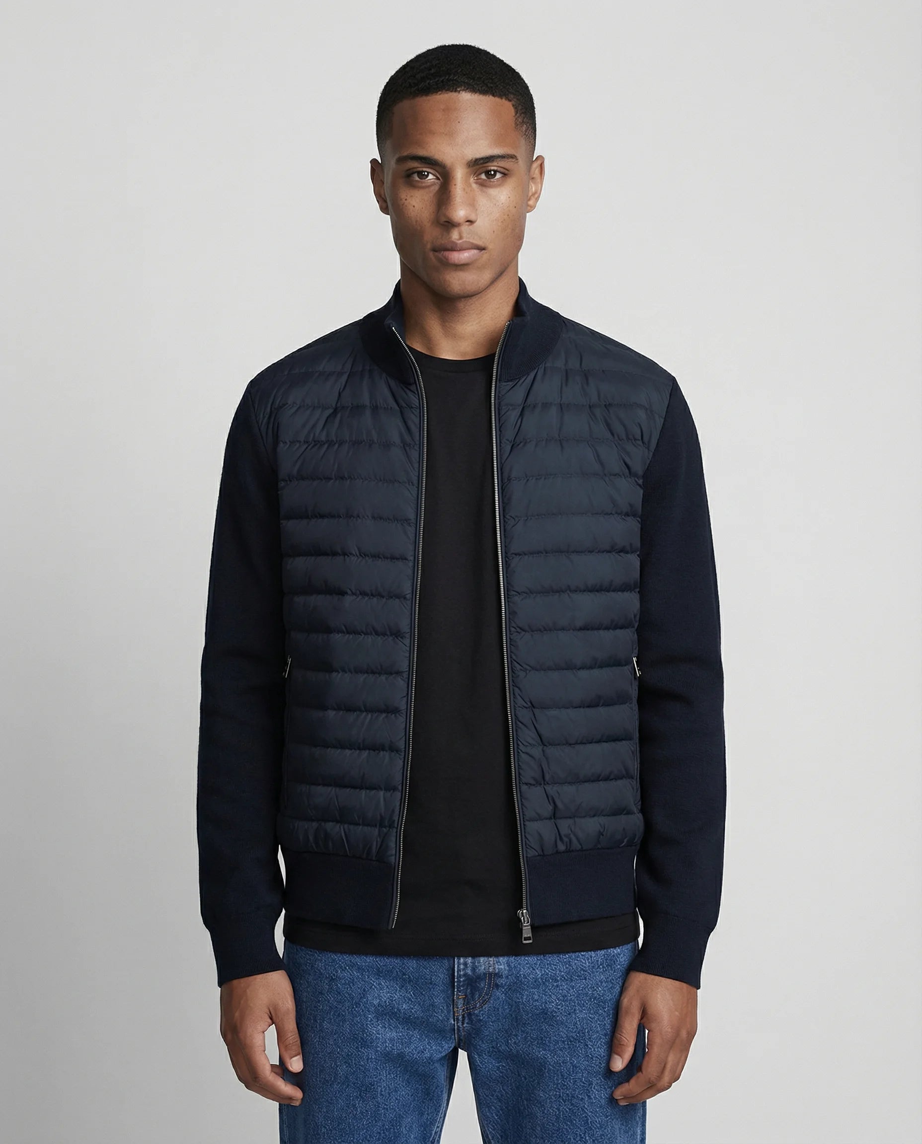 Men's quilted knit bomber jacket in navy blue by Ilynora, front view with padded panel and clean silhouette