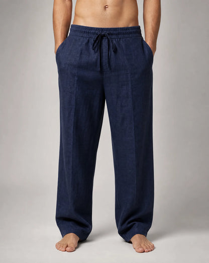 Men's dark blue linen trousers with relaxed fit and timeless summer styling by ILYNORA
