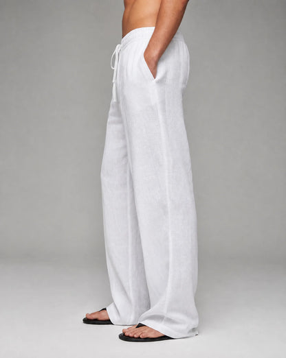 Men's white linen trousers with relaxed fit and lightweight warm-weather style by ILYNORA