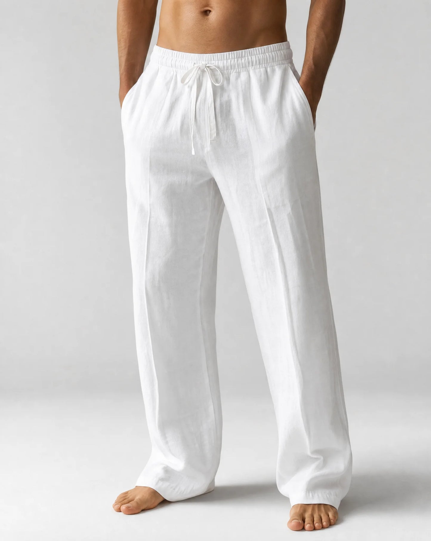 Men's white relaxed fit linen trousers with breathable fabric and summer comfort by ILYNORA