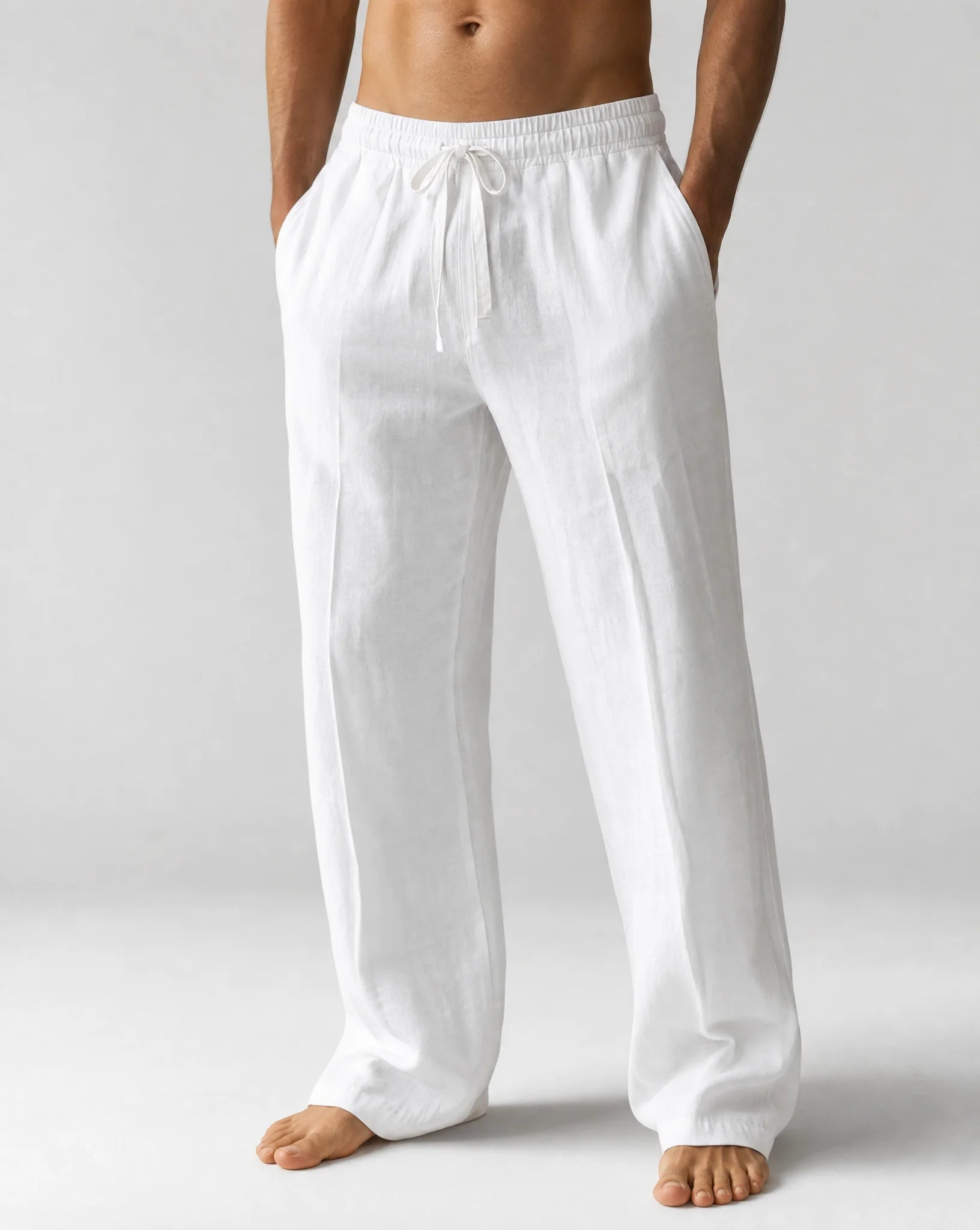 Men's white relaxed fit linen trousers with breathable fabric and summer comfort by ILYNORA
