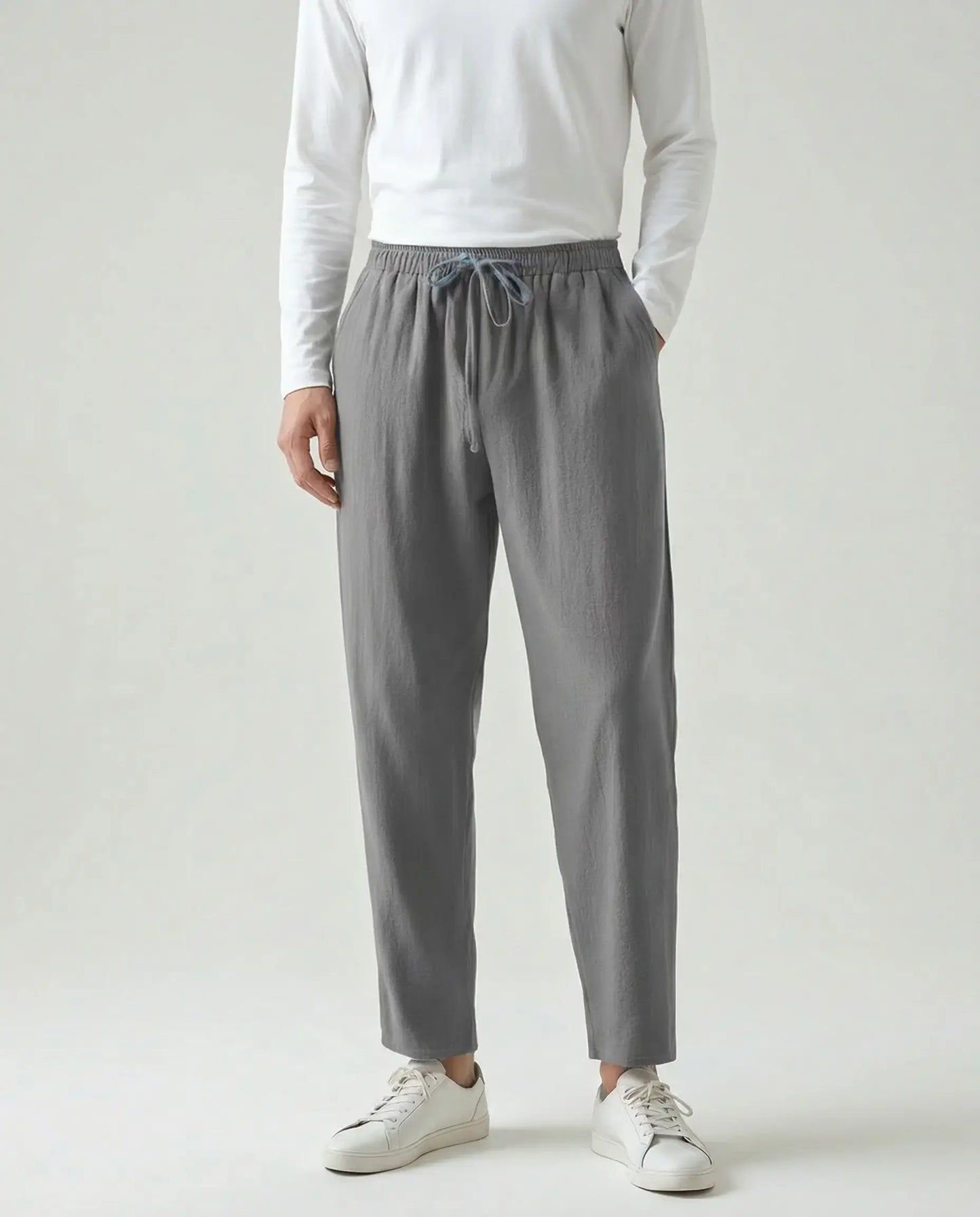 Men's relaxed linen drawstring trousers in grey by Ilynora, front view with relaxed fit and modern silhouette