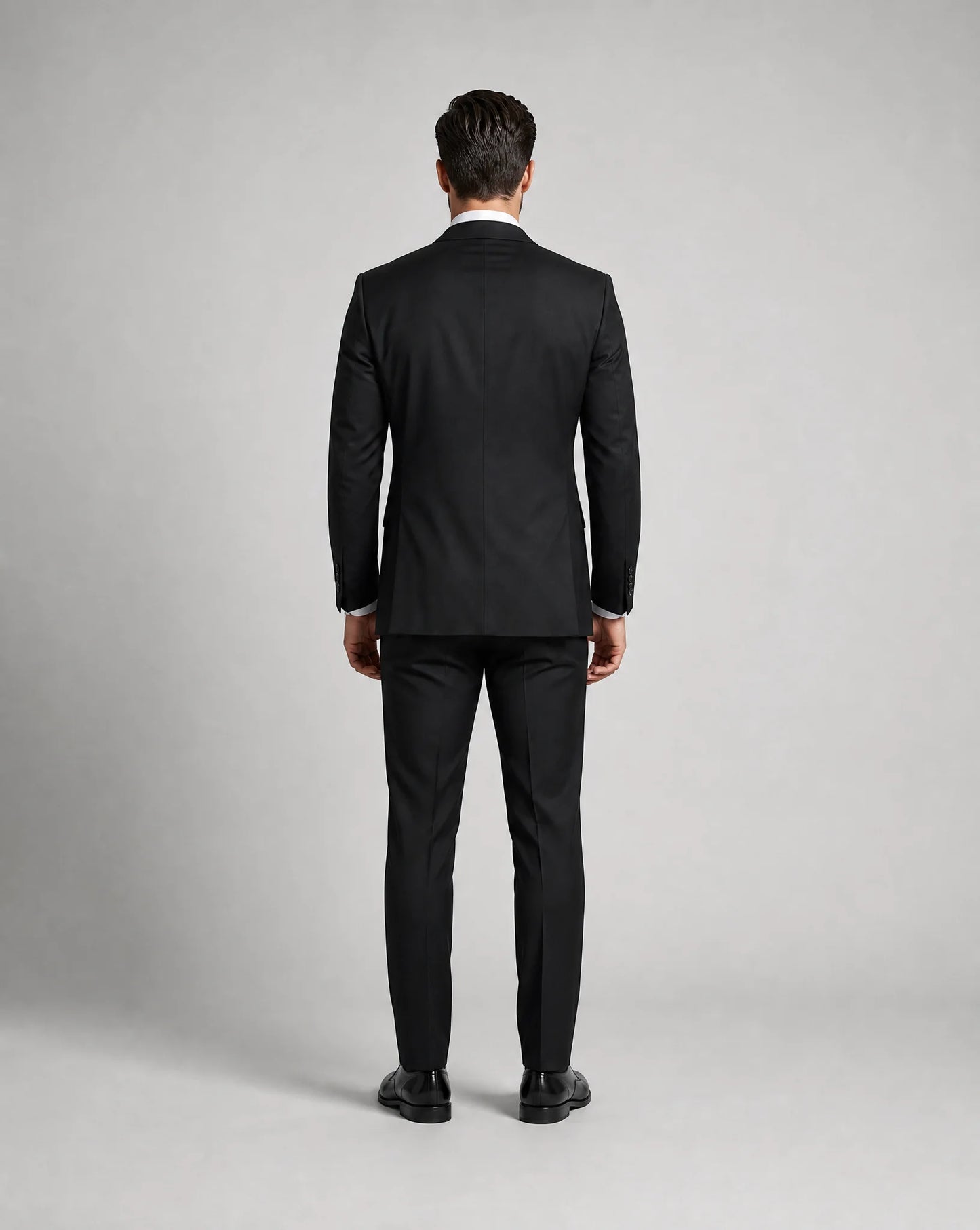 Black slim fit three piece suit back view with tailored fit and formal occasion styling by ILYNORA