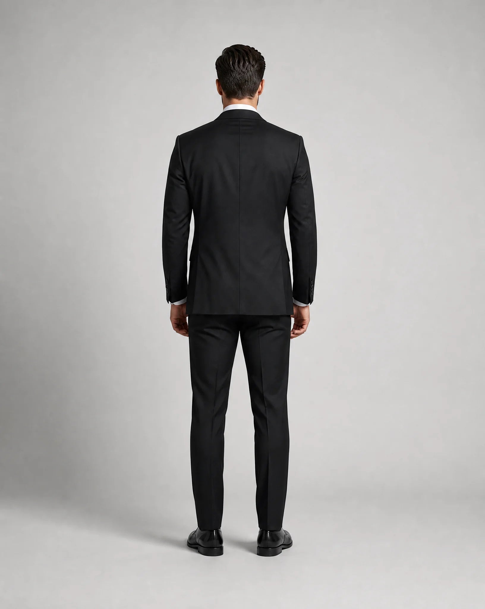 Black slim fit three piece suit back view with tailored fit and formal occasion styling by ILYNORA