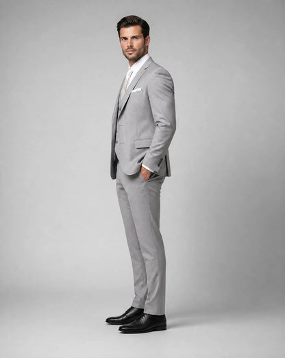 Light grey slim fit three piece suit with modern formalwear silhouette by ILYNORA