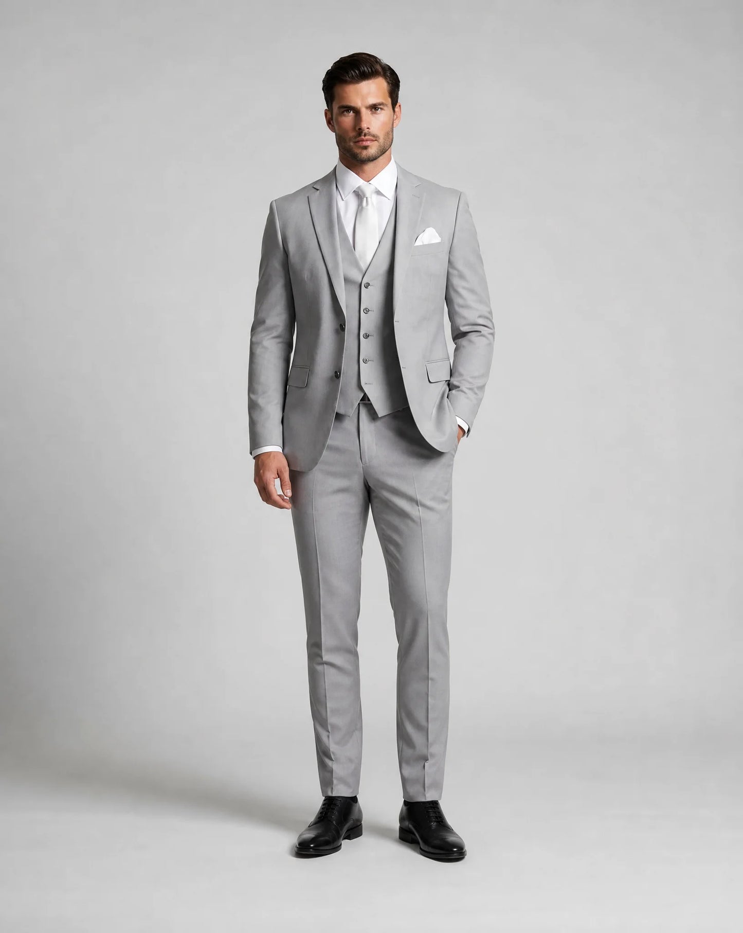 Light grey slim fit three piece wedding suit with tailored blazer and waistcoat by ILYNORA