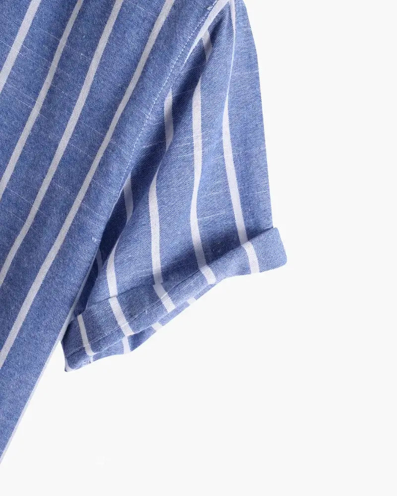 Striped polo shirt in blue by Ilynora, close-up showing vertical stripe pattern and soft cotton texture