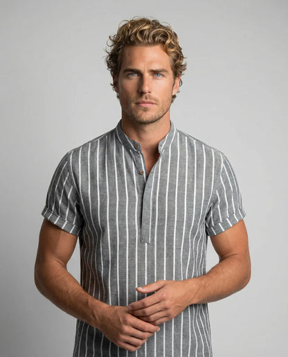 Men's striped sailor cotton polo shirt in grey by Ilynora, front view with vertical stripes and relaxed silhouette