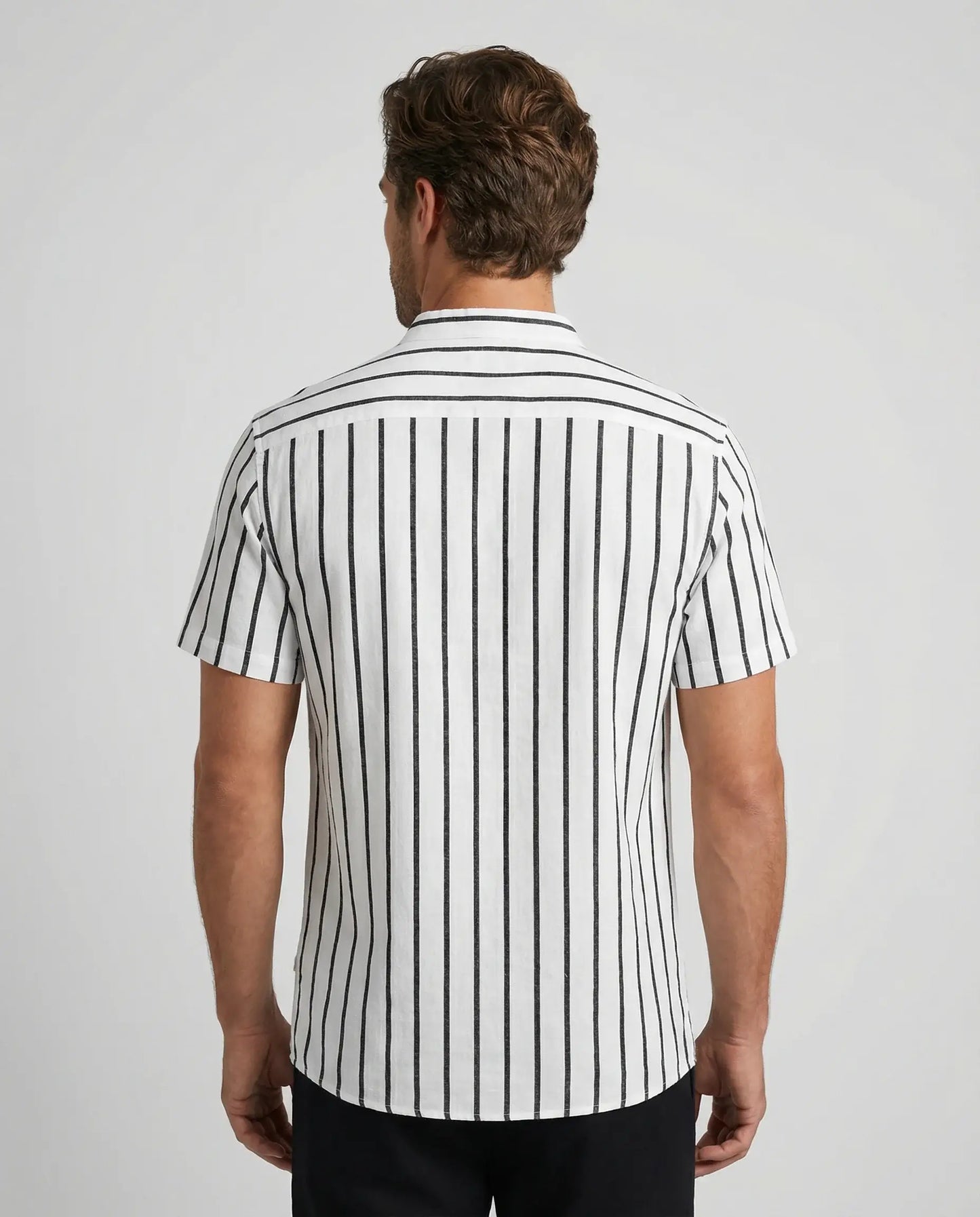 White striped polo shirt by Ilynora, back view highlighting clean design and lightweight cotton fabric