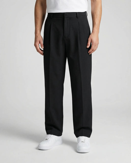 Black tailored wide leg trousers for men by Ilynora, front view with relaxed fit and clean silhouette