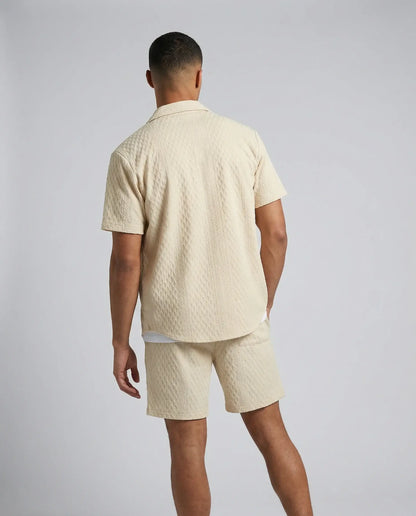 Khaki textured shirt and shorts set by Ilynora, back view highlighting matching set and clean silhouette