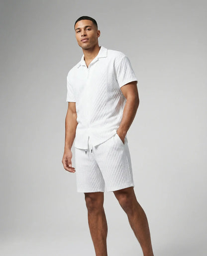 Men's textured shirt and shorts set in white by Ilynora, full body view with lightweight fabric and clean summer look