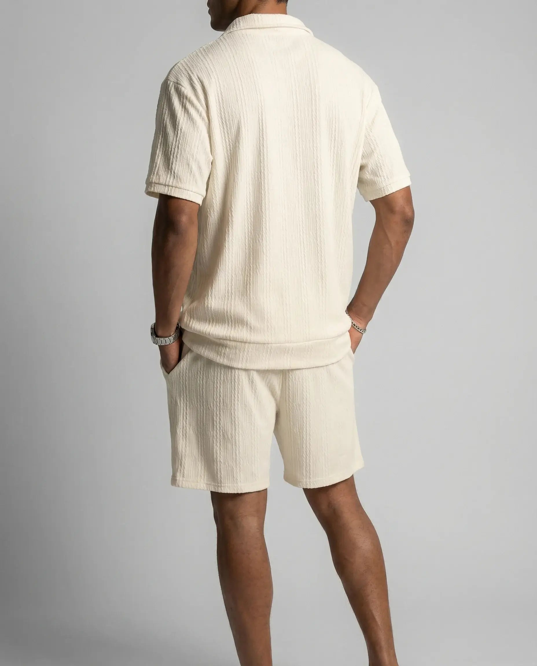 Beige zip polo and shorts set by Ilynora, full body view showing relaxed fit and clean design