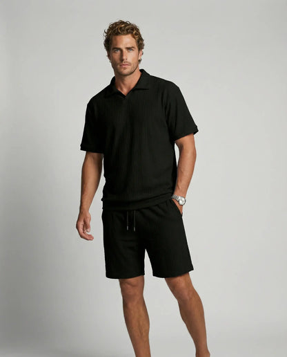 Men's textured zip polo and shorts set in black by Ilynora, front view with clean silhouette and modern look
