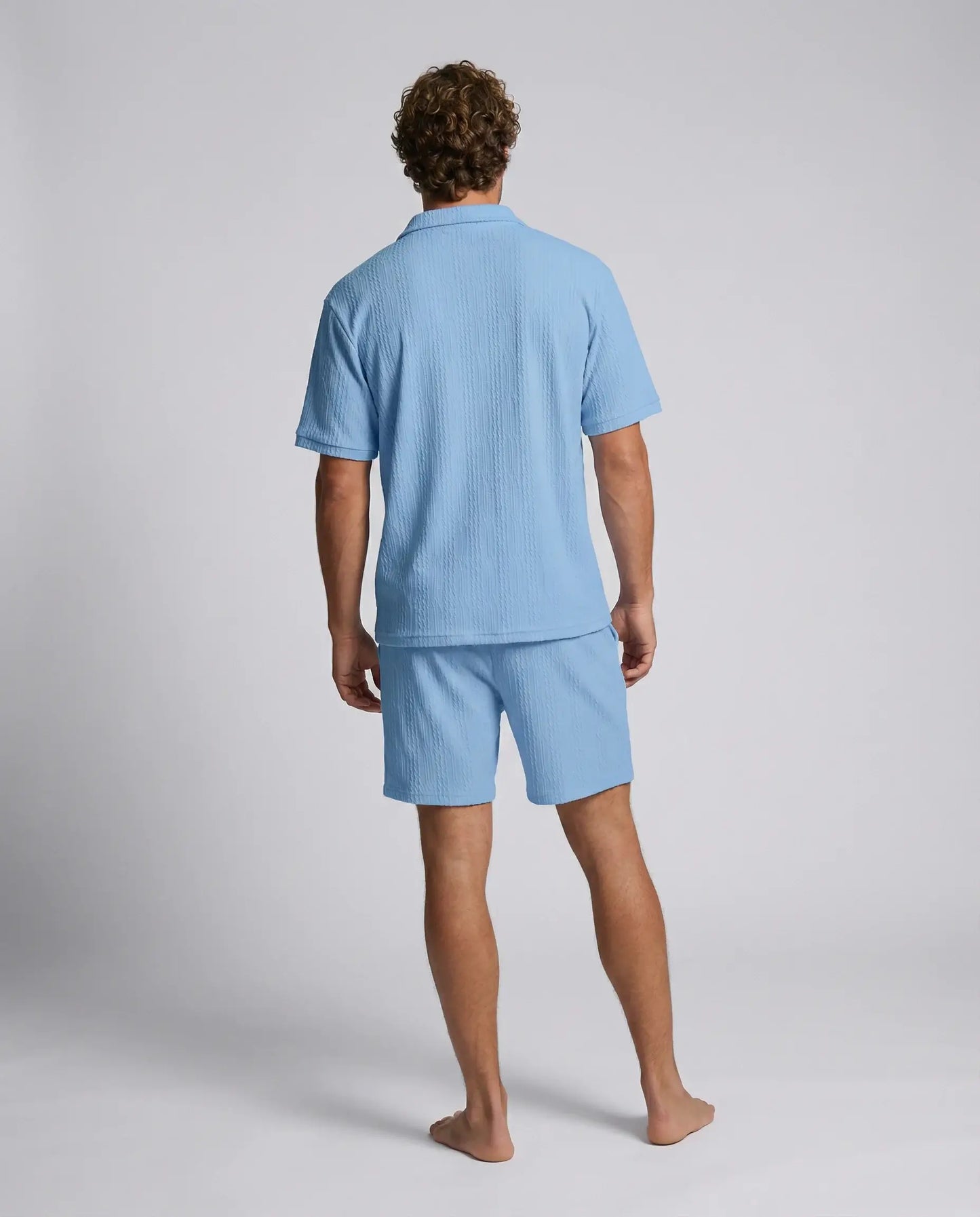 Blue zip polo and shorts set by Ilynora, back view highlighting breathable fabric and coordinated design