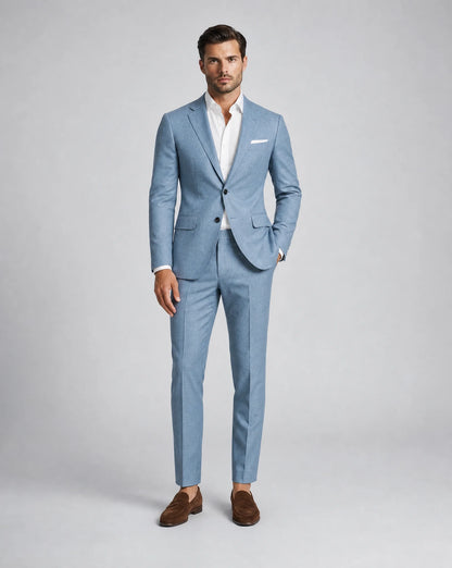 Men's aqua blue two piece linen suit with lightweight tailoring and stylish summer occasion look by ILYNORA