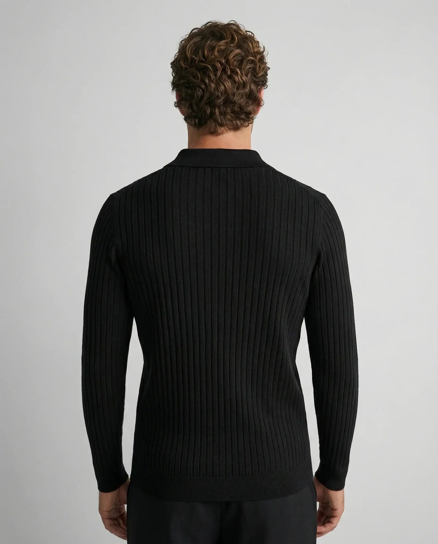 Black V-neck knit jumper by Ilynora, back view with structured knit and classic design
