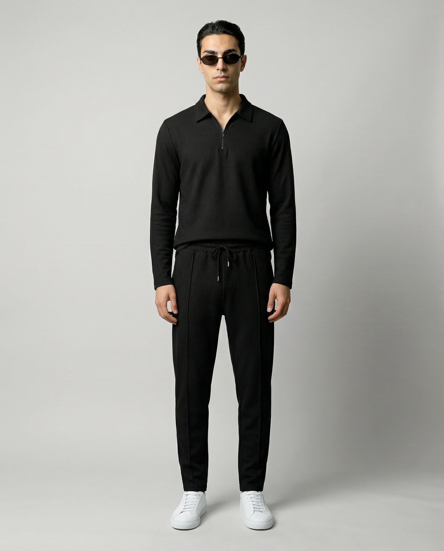 Black men’s zip lounge set by Ilynora, front view with relaxed fit and modern silhouette