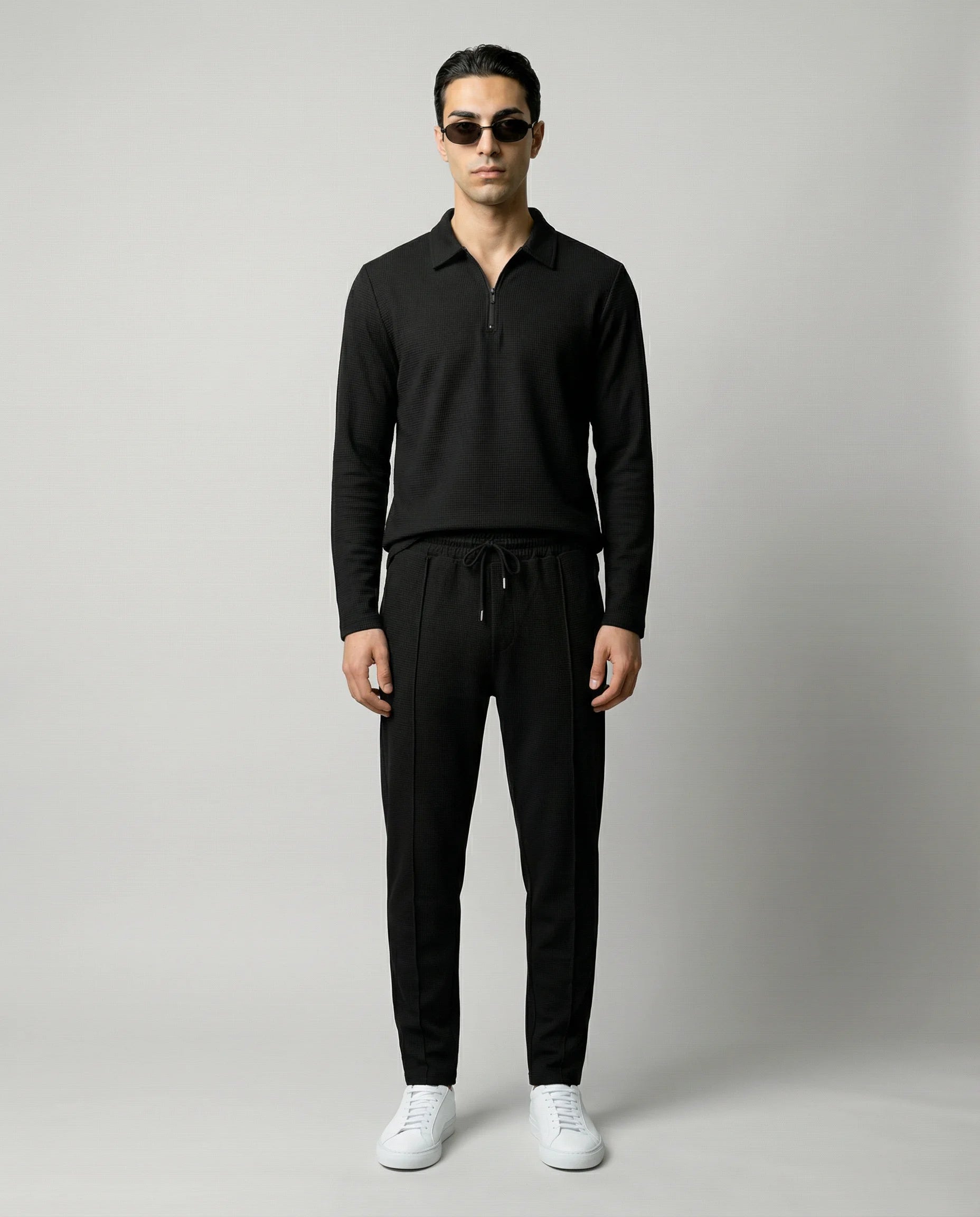 Black men’s zip lounge set by Ilynora, front view with relaxed fit and modern silhouette