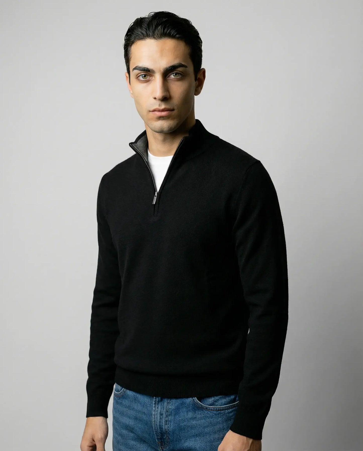 Men's zip neck sweater in black by Ilynora, front view with clean lines and structured fit