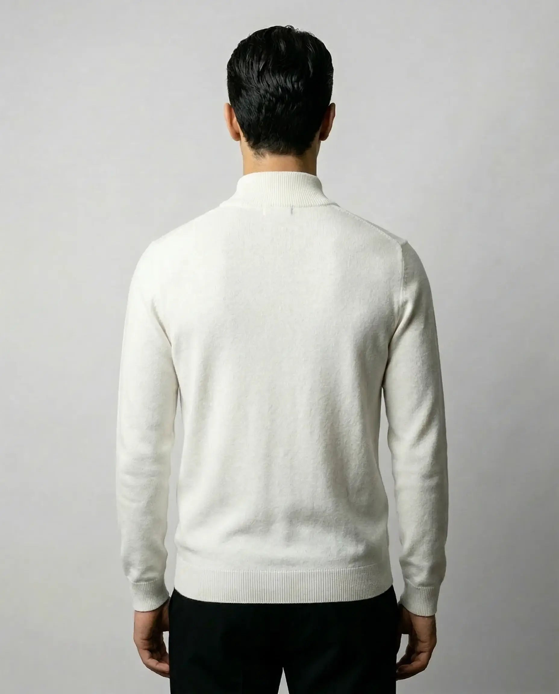 White zip neck sweater by Ilynora, back view highlighting soft knit texture and minimal silhouette