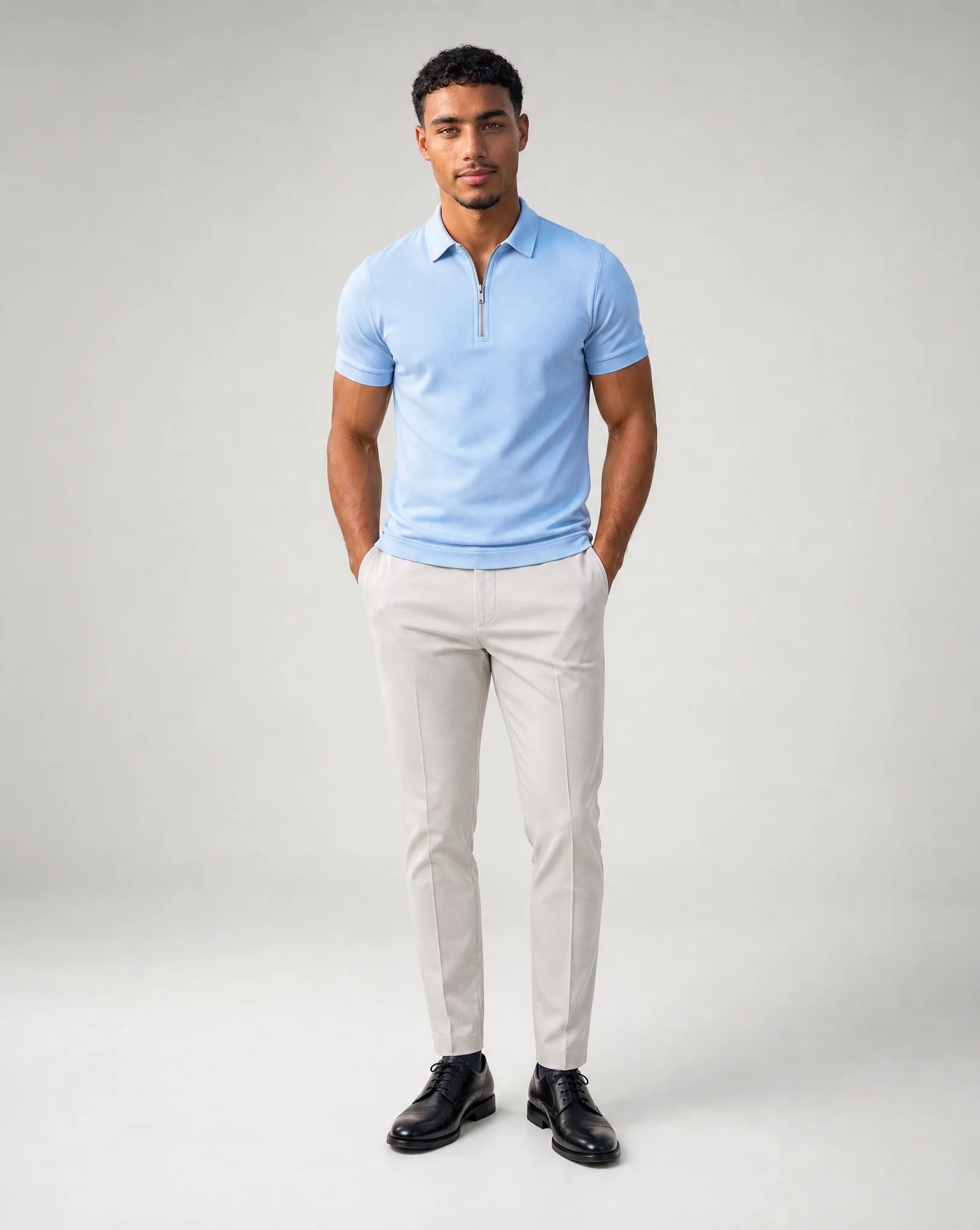 Men's light blue polo shirt with zip collar and tailored fit for everyday wear by ILYNORA