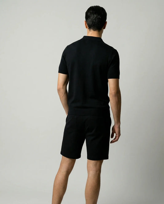 Black zip polo and shorts set for men by Ilynora, back view of matching outfit with relaxed fit