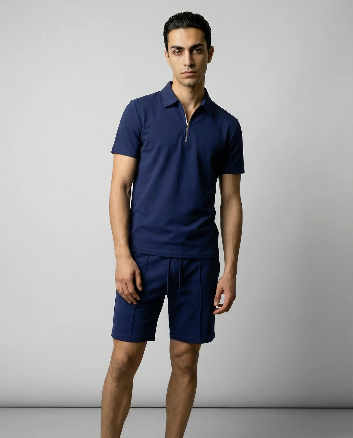 Navy blue zip polo and shorts set for men by Ilynora, clean matching outfit with modern relaxed fit
