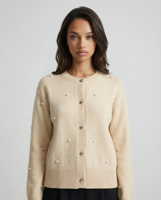 Cream embellished knit cardigan for women by Ilynora, front view with pearl details and button closure